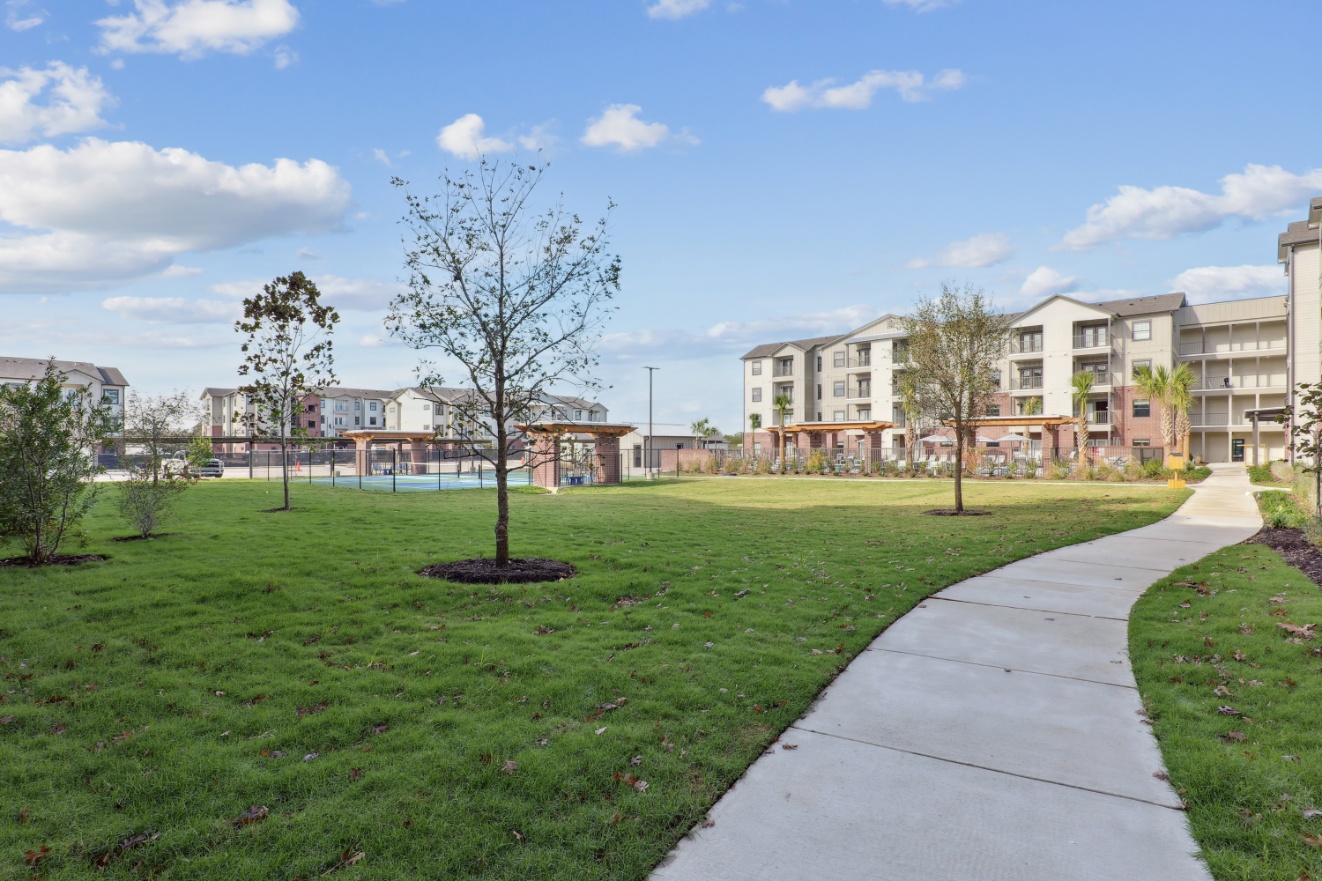 Green space and walking path at Brazos Oaks